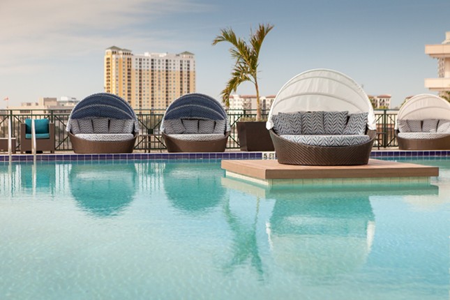 Tampa Marriott Water Street
505 Water St., Tampa, 813- 221-4900    
$20-$1,000
    Spend your “daycation” wisely at Tampa Street’s Marriott rooftop pool, complete with food and drinks, cornhole, paddle board and kayak rentals (for the nearby Hillsborough River). Plus, there’s free Wi-Fi and discounted valet. Day passes for adults start at $20 and $10 for kids, but other options include luxury daybeds ($75), daytime luxury cabanas ($150) and $1,000 to keep the cabana into the night with $300 food and drink credits as well as a reservation at the hotel’s waterfront restaurant, Anchor & Brine.
       Photo via Tampa Marriott Water Street/Facebook