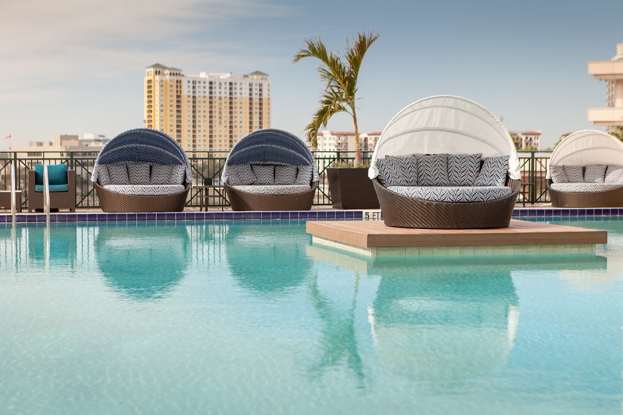 Tampa Marriott Water Street
505 Water St., Tampa, 813- 221-4900    
$20-$1,000
Spend your “daycation” wisely at Tampa Street’s Marriott rooftop pool, complete with food and drinks, cornhole, paddle board and kayak rentals (for the nearby Hillsborough River). Plus, there’s free Wi-Fi and discounted valet. Day passes for adults start at $20 and $10 for kids, but other options include luxury daybeds ($75), daytime luxury cabanas ($150) and $1,000 to keep the cabana into the night with $300 food and drink credits as well as a reservation at the hotel’s waterfront restaurant, Anchor & Brine.
Photo via Tampa Marriott Water Street/Facebook