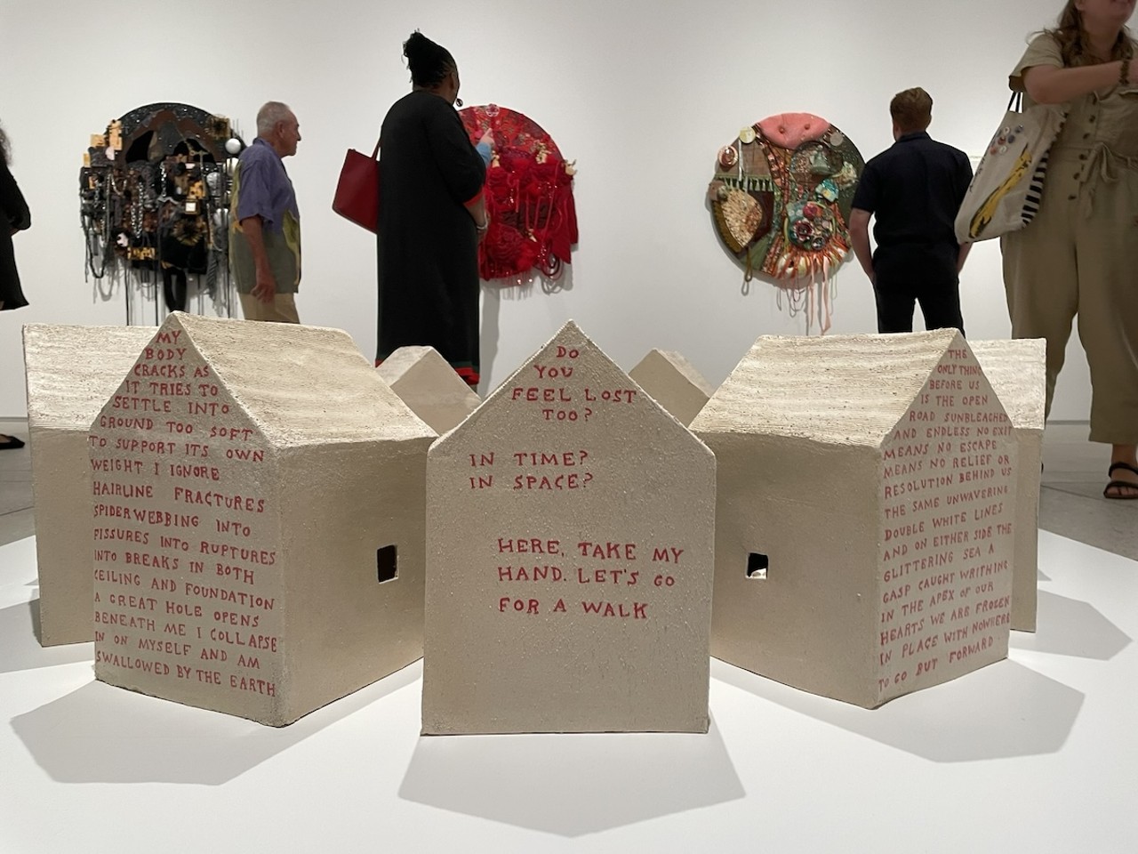 Former St. Pete resident Cort Hartle incorporated her own poetry onto a circle of ceramic homes, sending the viewer/reader on a walk around the neighborhood at Tampa Museum of Art.