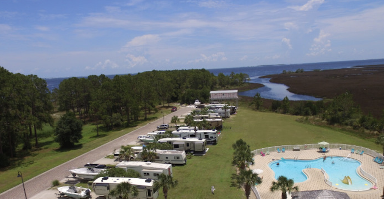 Sunset Isle RV Park 
Cedar Key
Sunset Isle RV Park is located steps away from the Gulf of Mexico and features prime real estate for activities like hiking, briding, canoeing and kayaking. The park is also just one mile from Carrabelle Beach. Booking a night at the park requires a reservation request that can be filled out on its website.
Photo via Sunset Isle Website