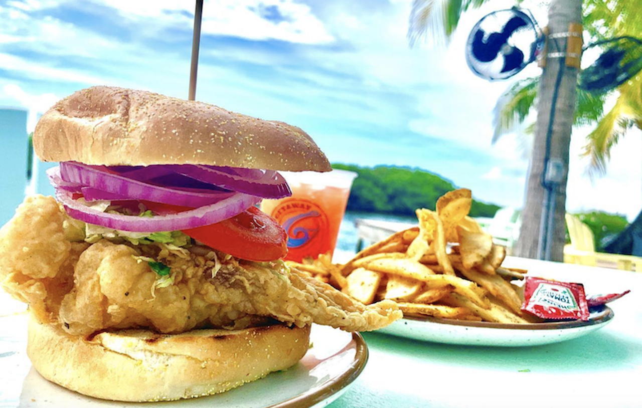 The Getaway
727-317-5751, 13090 Gandy Blvd N, St. Petersburg facebook.com/thegetawaytampabay  
Bayside tiki bar The Getaway offers a red grouper sandwich for $18, served grilled, blackened or crispy. It comes with lettuce, tomato, onion and a citrus remoulade, but they recommend adding avocado and smoked mozzarella. 
Photo via The Getaway/Facebook