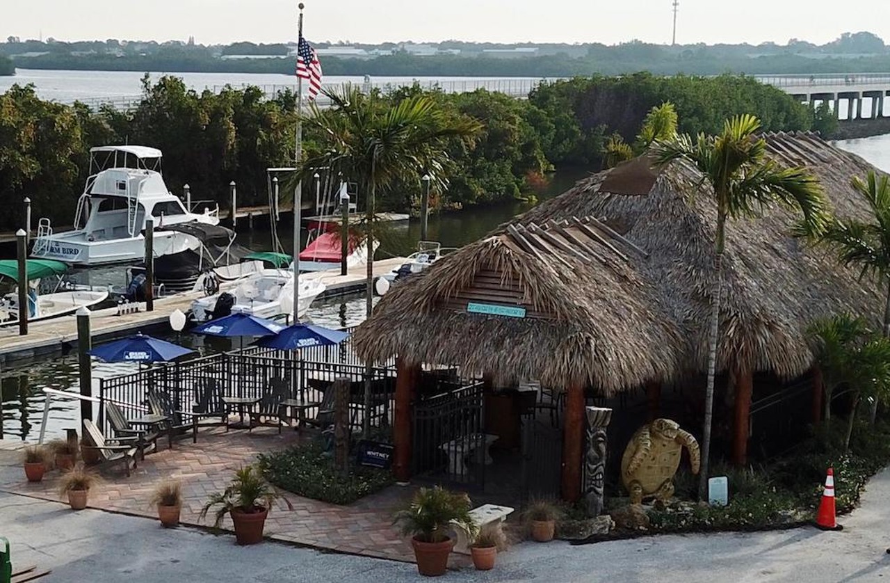 Harbor Master Tiki Grille
5000 92nd St. N, St. Petersburg, 727-256-3383
Home to a fresh fish menu, 24 taps and public boat access, this St. Pete waterfront tiki bar is one of the locals’ go-to spots. Favorites off the menu include the smoked fish spread, fried banana peppers, ginger lime Island Time shrimp and jumbo beef hotdogs. Expect live local music, competitive games of corn hole and good ole’ time.
Photo via Harbor Master Tiki Grille/Facebook