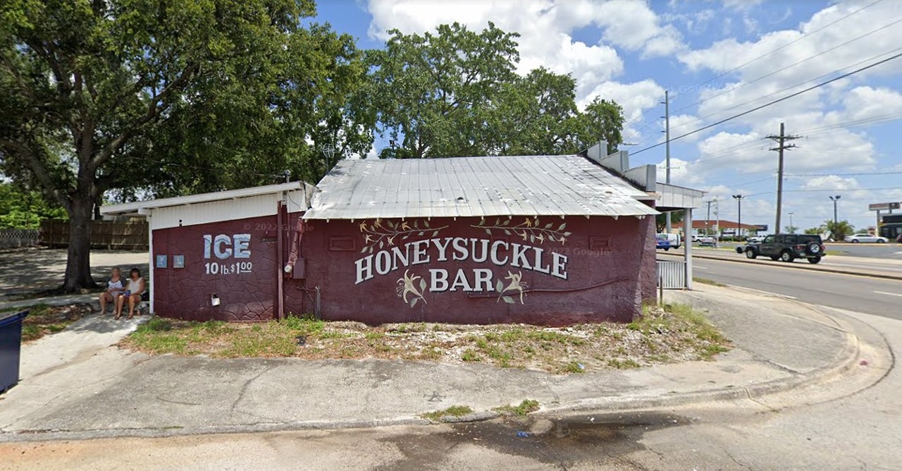 Honeysuckle Bar 
119 W Waters Ave., Tampa, 813-932-1429
Buckle up for this one because it’s a true dive, nicotine-stained Nascar merch and all. The outside is very unassuming and to be honest, so is the inside. It’s beer-only, so you’ll have to make a choice between Bud or Busch, and pay with cash. Between the cigarette vending and coin-operated washing machines, you’ll find this is a place to have a strong opinion about one way or the other. 
Photo via Honeysuckle Bar/Google