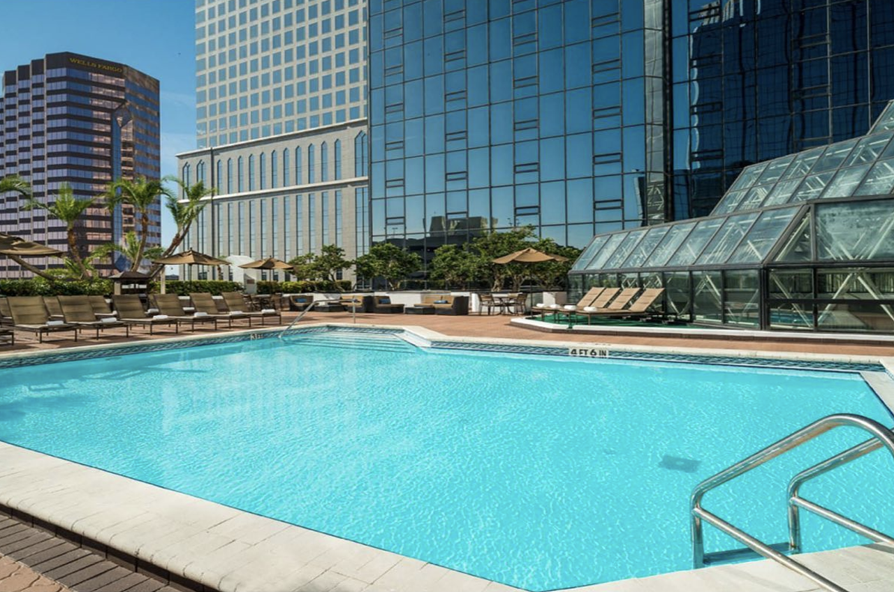 Hilton Tampa Downtown
211 N Tampa St., Tampa, 813-204-3000    
$12
For $12, get access to Hilton Tampa Downtown’s rooftop pool, fitness center and whirlpool hot tub with amenities like discounted poolside food and drink service and free Wi-Fi. Entry is free for infants. Park at the hotel using valet for $25 or use hourly self-parking at the nearby Fort Brooke parking garage. 
Photo via Hilton Tampa Downtown/Facebook