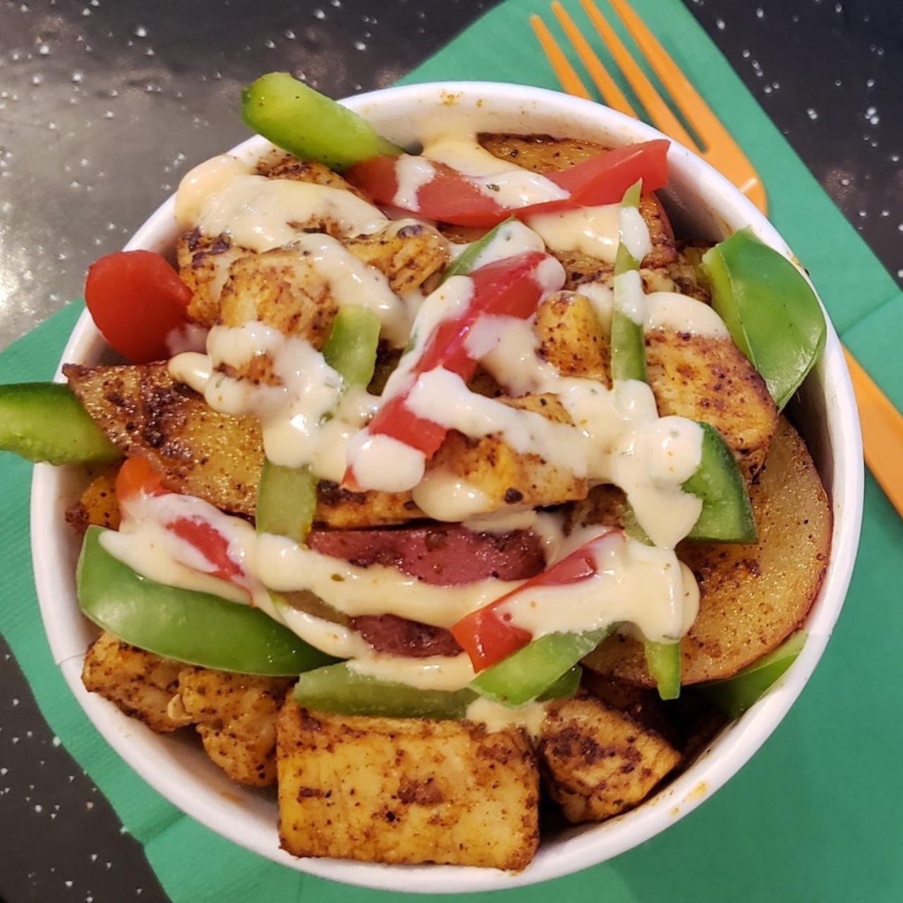 Spicy Loaded Potato Bowl
This spin on the Ma's Irish Kitchen classic finishes Cajun potatoes with grilled chicken, bell peppers and spicy ranch.