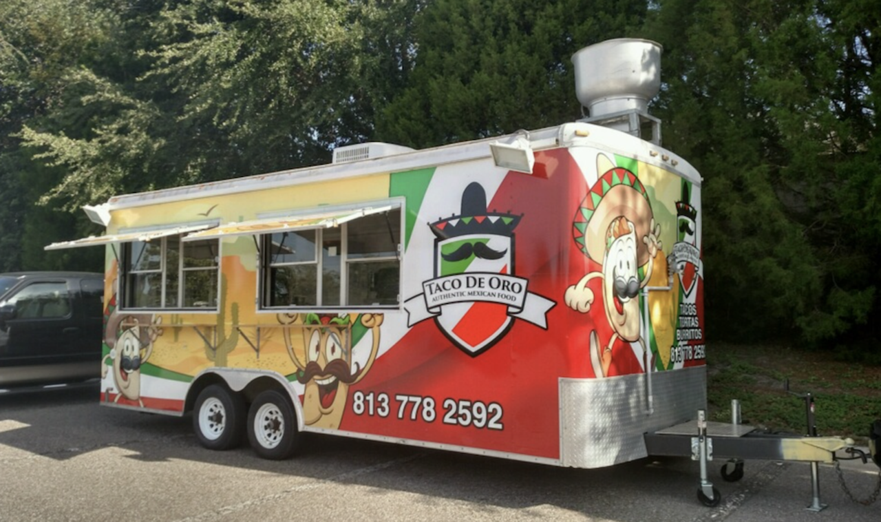 Taco De Oro
Multiple locations
Next to a Mobil car wash, this cart is eye-catching thanks to its Mexican flag color paint job and a friendly taco character slapped on the side. You can't go wrong with $2 tacos. 
Photo via Tacos De Oro/Website
