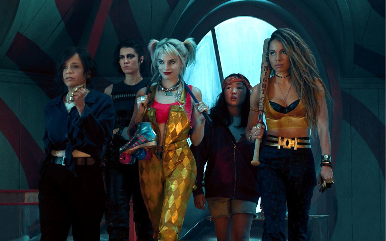 Harley Quinn, center, is flanked by Det. Montoya and Huntress to the left and Cassandra Cain and Black Canary to the right.
