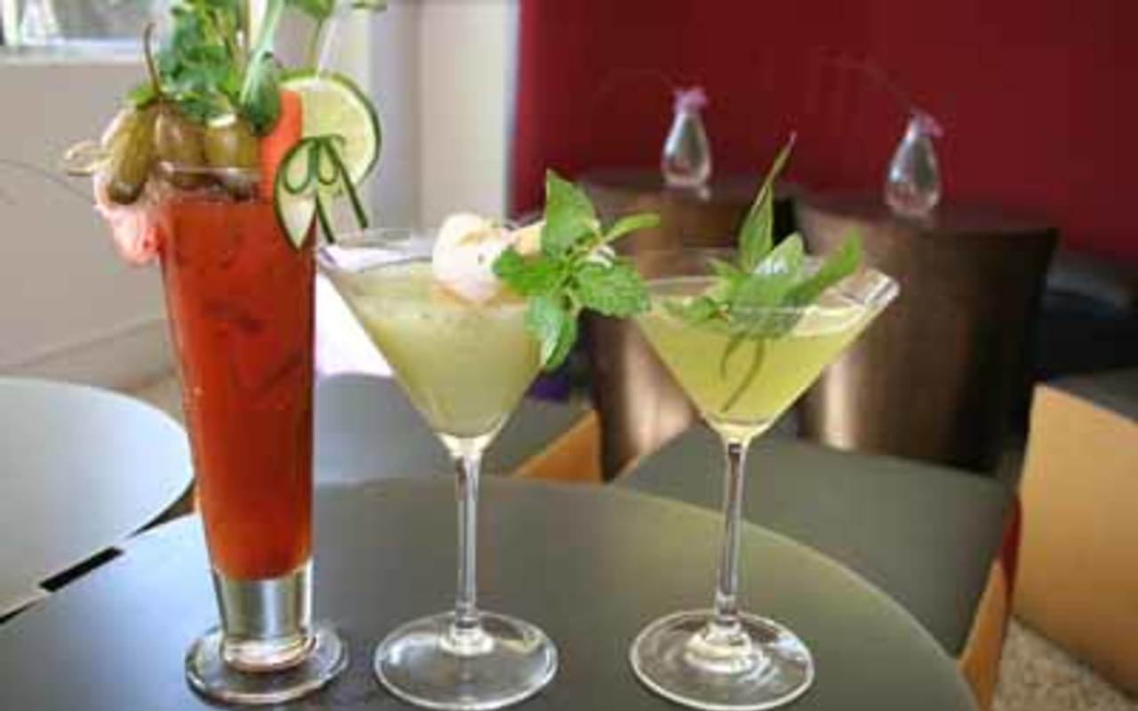 HAPPY HOUR: (Left to right) Restaurant BT's Bloody Mary, Lychee Ginger martini, Herbacious Martini.