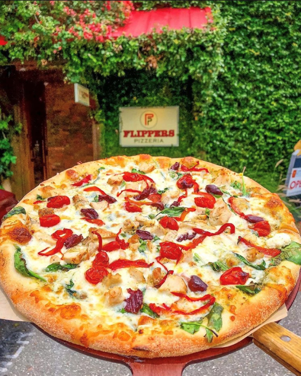 Flippers Pizzeria
1054 4th St. N., St Petersburg
(727) 822-9860
flipperspizzeria.com  
$10 - MyPie Mediterranean Chicken Pizza: 11" Signature MyPie featuring organic spinach, basil pesto sauce, roasted red peppers & Grape tomatoes, Kalamata olives, aged mozzarella, & feta cheese. Add on a $3 Peroni!
Takeout (call-in), Online ordering (pickup), Curbside pickup, Dine-in, Delivery