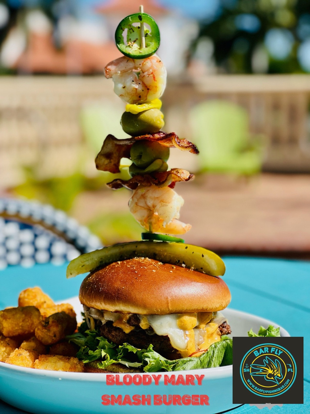 
Bar Fly Safety Harbor
100 Main St. #101, Safety Harbor
Bloody mary smash burger: (2) smash ground chuck patties mixed in bloody mary mix, swiss cheese, lettuce, tomato, horseradish aioli topped with a bloody mary skewer with shrimp & bacon! ($17)
Photo courtesy of Bar Fly Safety Harbor