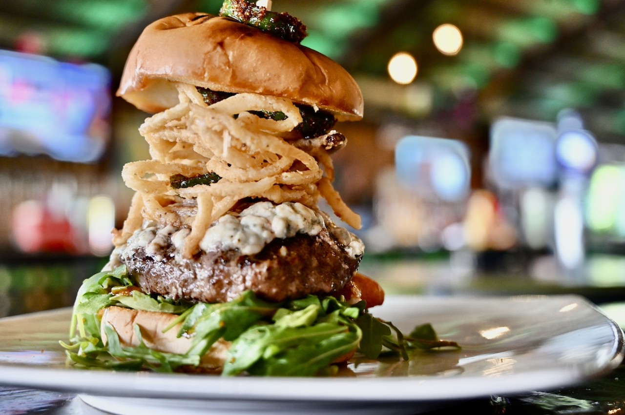 
Green Iguana
4029 S West Shore Blvd., Tampa
The I.C.B.M.: A burger patty topped with, mac and cheese bites, blue cheese crumbles, candied jalapeños, onion straws, rocket lettuce, tomato and mild sauce. ($15)
Photo courtesy of Green Iguana
