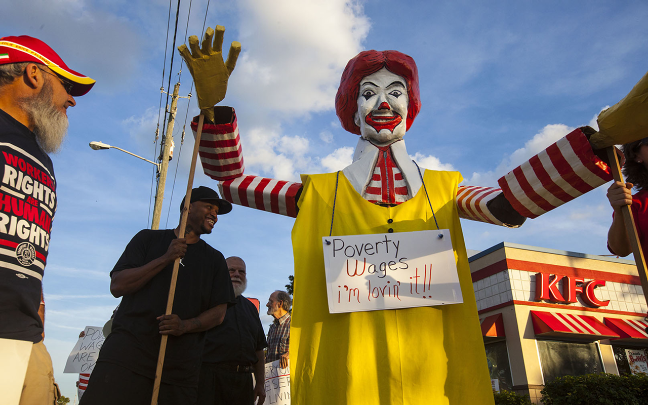 NOT SO FAST: Fast food workers protested low wages outside a KFC in North Tampa last month.