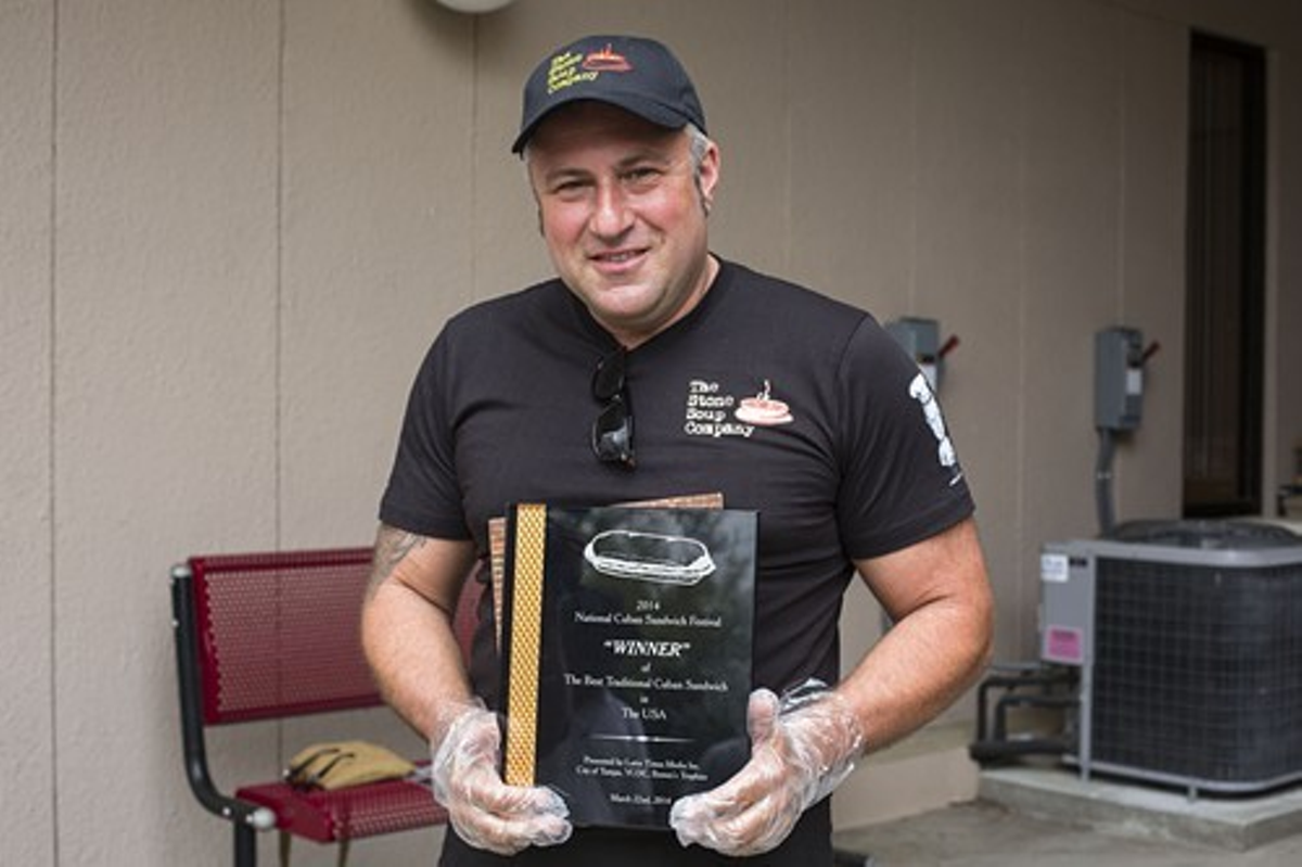 Stone Soup Company's Ilya Goldberg with his plaque for winning Best Cuban Sandwich in Ybor's 2014 Cuban Sandwich Festival.