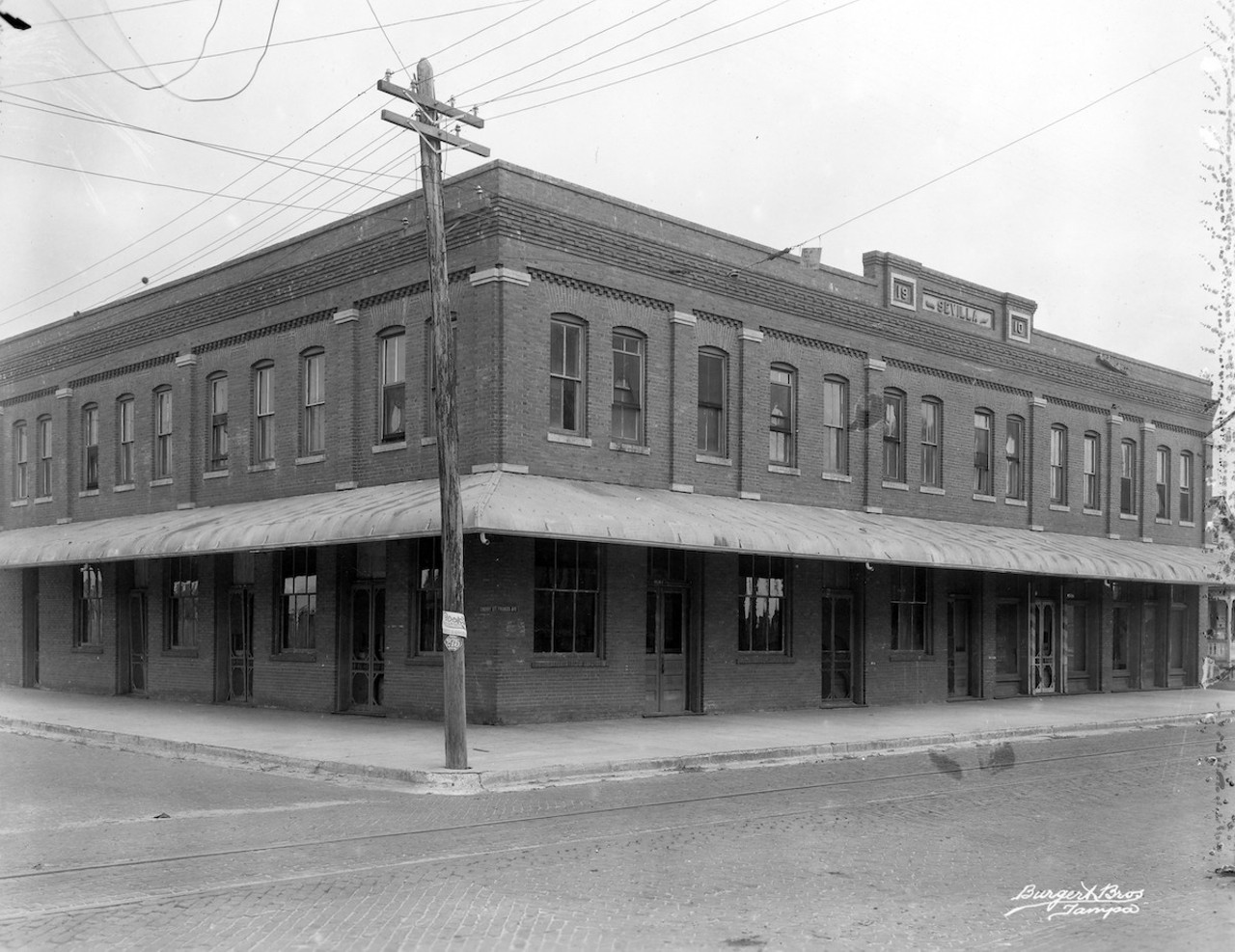 Strike Street soup, 1920
Unlike most Floridians, the immigrants of Ybor City and West Tampa (Sevilla building c.1923, pictured here) were not sheepish about unionizing and making demands of their employers. Unions managed to score a few victories in the early years, but they did not continue. When the cigar industry originally settled in Tampa, it did so with the knowledge that the city had agreed to lend its police force to the factory owners when labor troubles arose. During the strike of 1920, determined workers endured for 10 months outside the factories. The Tampa Tribune, at the time a zealous anti-labor advocate, raised the specter of “over-paid and corn-fed agitators [who] intend to absolutely annihilate the cigar industry in this city.” Labor newspaper El International fired back, saying that the pampered factory owners “Don’t know the anarchist-breeding effect of hunger on the victim ... champagne and caviar have always been at their service.”
In 1920, the producers stood firm against the strike, and employed the police and vigilantes to ransack the soup kitchens. They threw the food into the manure-laden streets. The destruction of soup kitchens dealt the union a deadly blow. Before long, even the most fanatical strikers began to cave. The strike ended in February 1921 with $12 million in wages lost. The unions never fully recovered from the debacle.
Photo via Burgert Brothers/USF