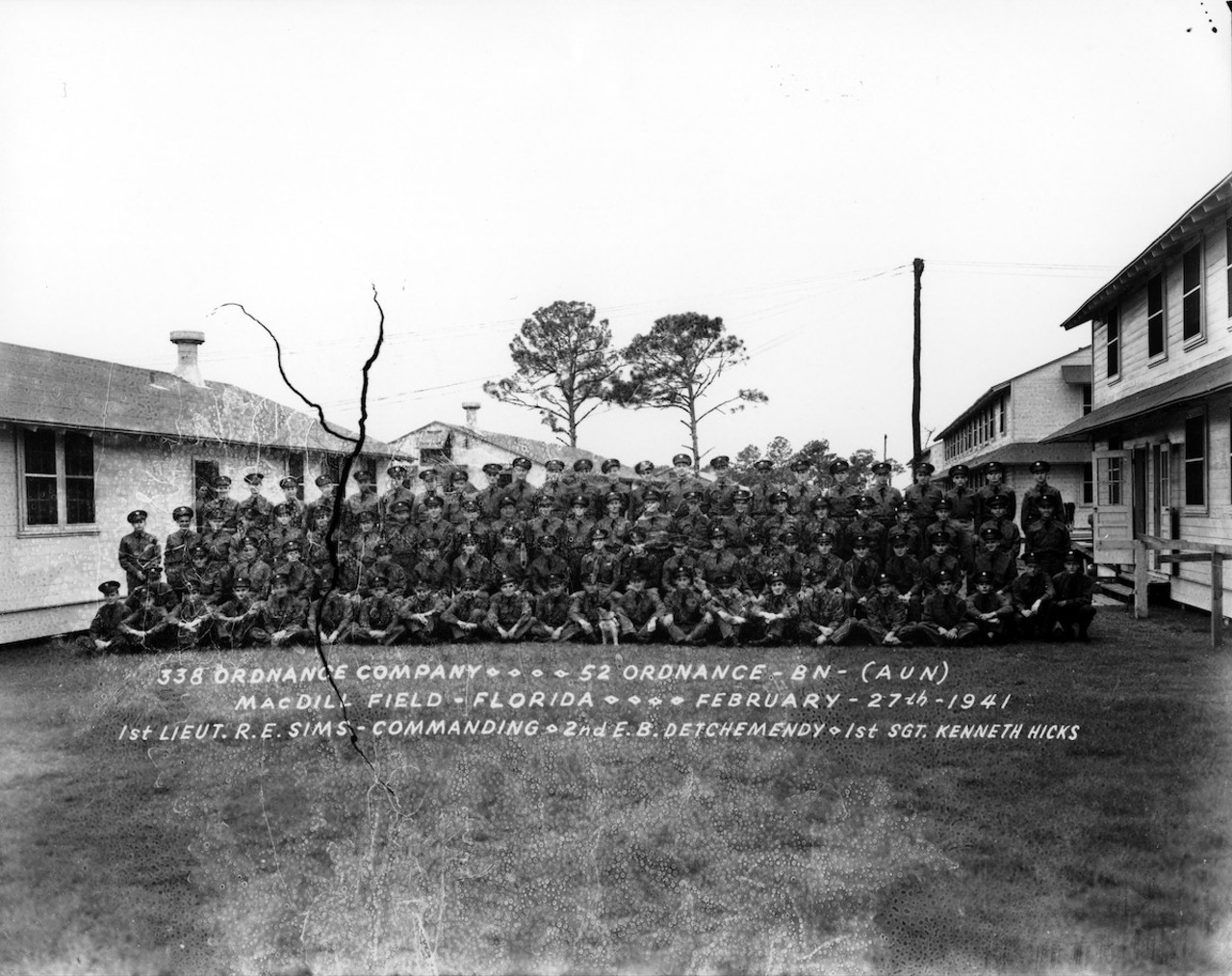 Christmas dinner, MacDill Field, 1941
Tampa was already home to important military installations when the Japanese attacked Pearl Harbor on December 7, 1941. The war led to construction of three air bases around the city: Drew Field, MacDill Air Force Base and Henderson Field, the remains of which lie beside the University of South Florida and the Yuengling Brewery (Mel’s Hot Dogs is its last remaining building).
The armed forces tried to make Christmas as pleasant as possible for recruits. The three airfields held a huge holiday feast for servicemen and their guests with white tablecloths and Christmas trees. The soldiers returned to the mess twice that day “on a basis of catch as catch can, no holds barred,” the Tribune observed. But the meal was marred by bad war news all over the world, and the holiday meals to follow would be less extravagant. Two years later, the commissaries cut the Christmas dinner luxuries found on the 1941 menu, such as ham, tomatoes, nuts, buttered peas, even pumpkin pie and lemonade. The ongoing war justified unprecedented military spending, especially in the southern U.S. Tampa has benefited from military spending ever since.Robertson and Fresh (Firm) and University of South Florida — Tampa Campus Library, "338 Ordnance Company - 52 Ordnance - BN - (AUN) - MacDill Field - Florida - February 27th 1941" (1941). Robertson and Fresh Collection of Tampa Photographs. Image 145.