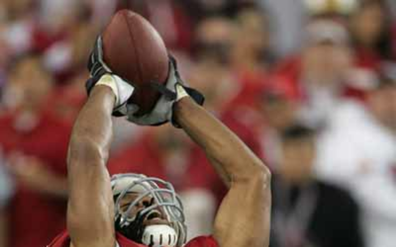 CARDINAL ACHIEVEMENT: The Cards' astounding Larry Fitzgerald in action.