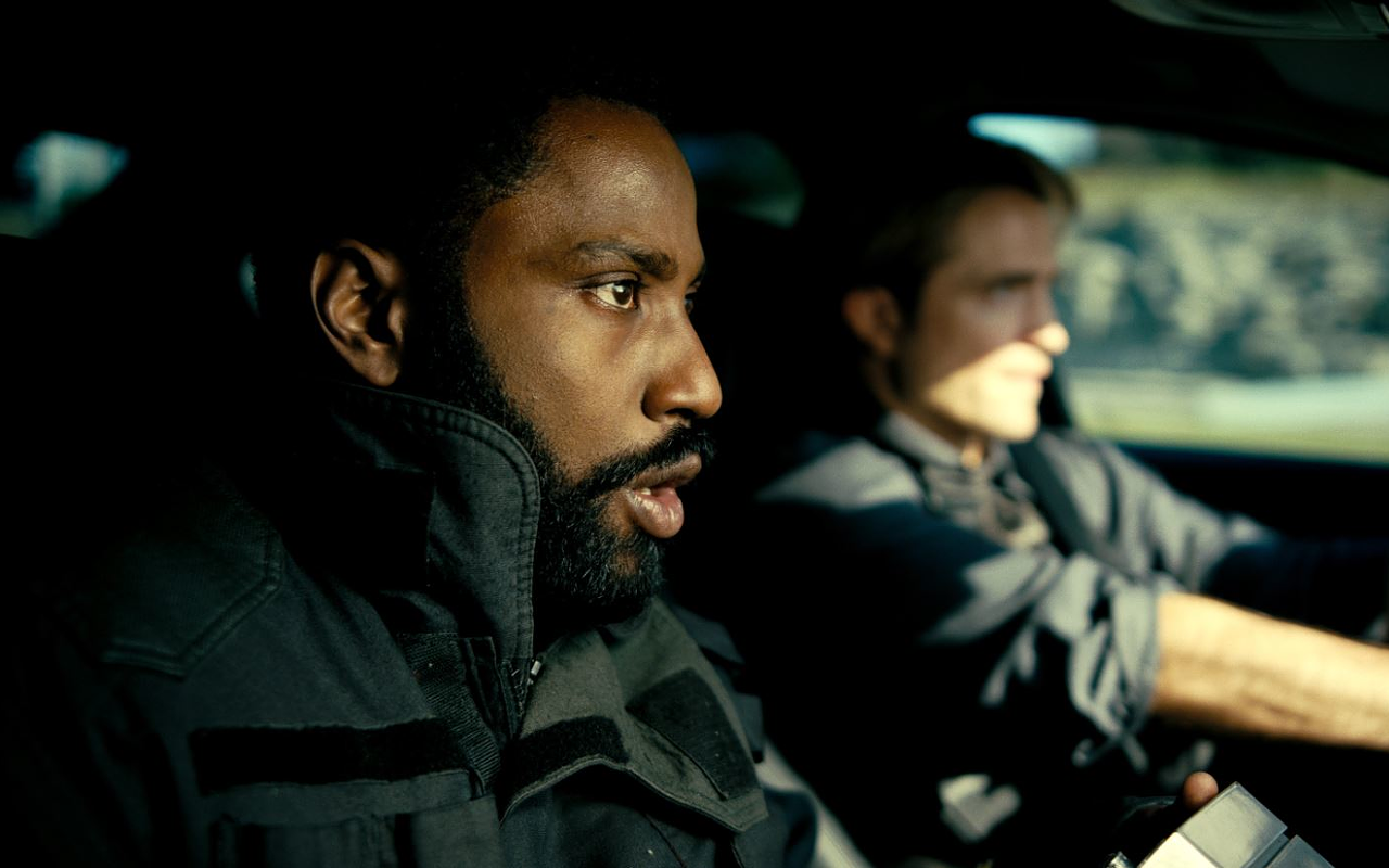 The Protagonist (John David Washington, left) and Neil (Robert Pattinson) fight to save the planet in real time, and inverted time, in "Tenet"