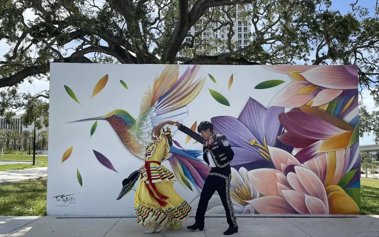 Mahetzi performs in front of Tutubixi&rsquo;s new mural at Coachman Park in Clearwater, Florida.