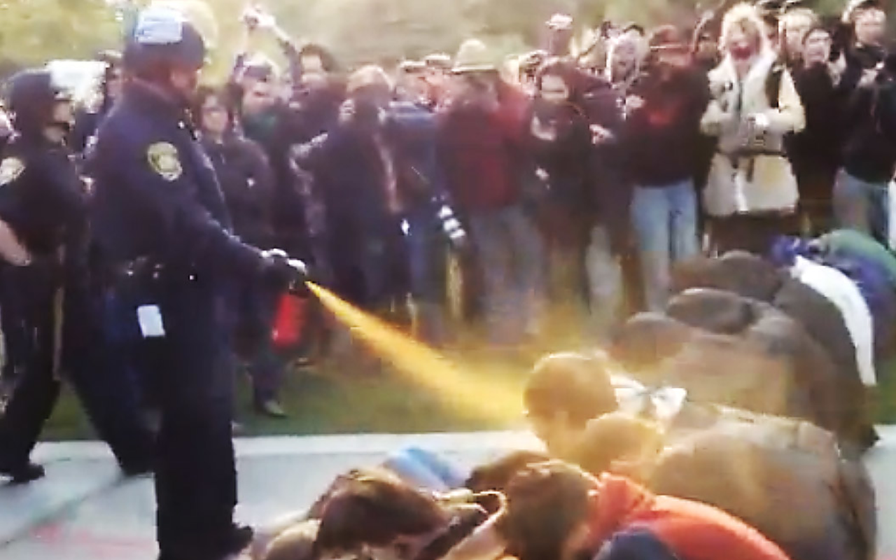 Clip from a video of police pepper-spraying students at a protest at UC Davis in 2011.
