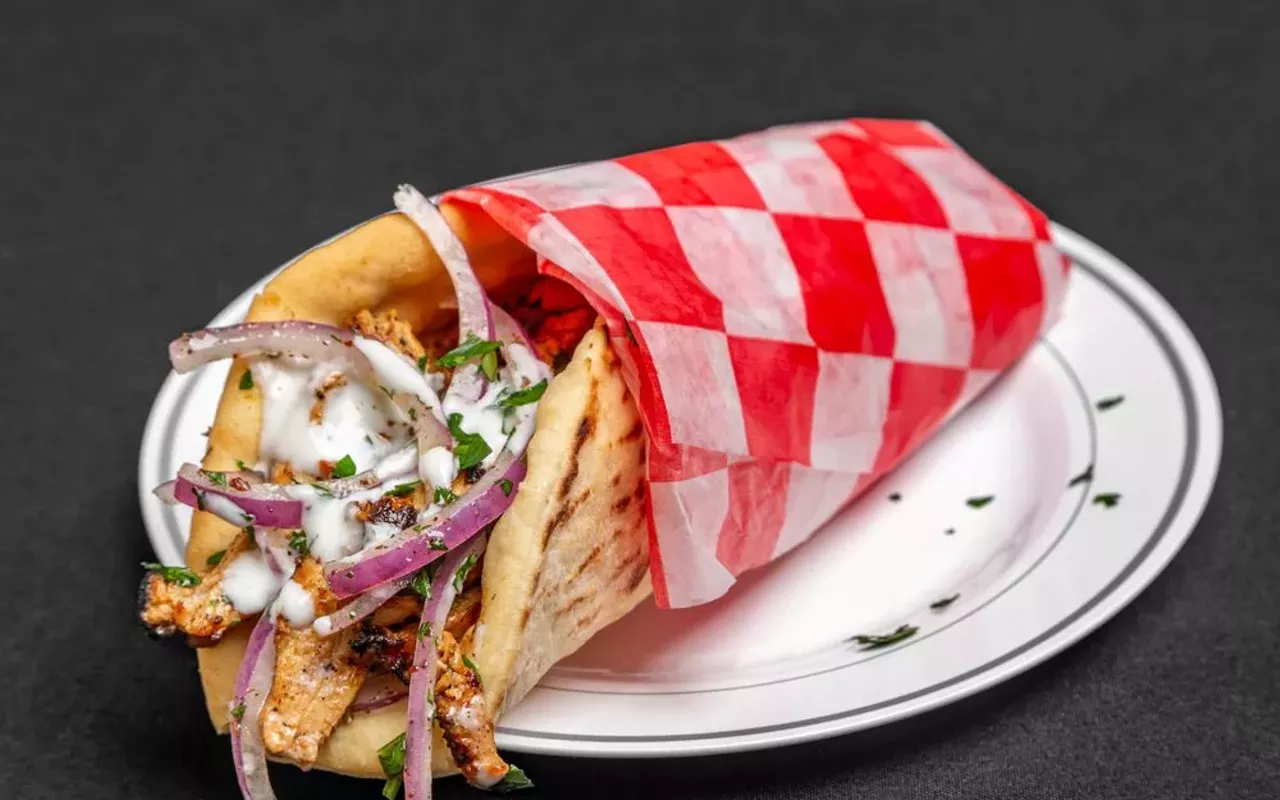 Cybel's chicken shwarma is garnished with sumac-marinated onions, parsley, pickles and a creamy garlic sauce.