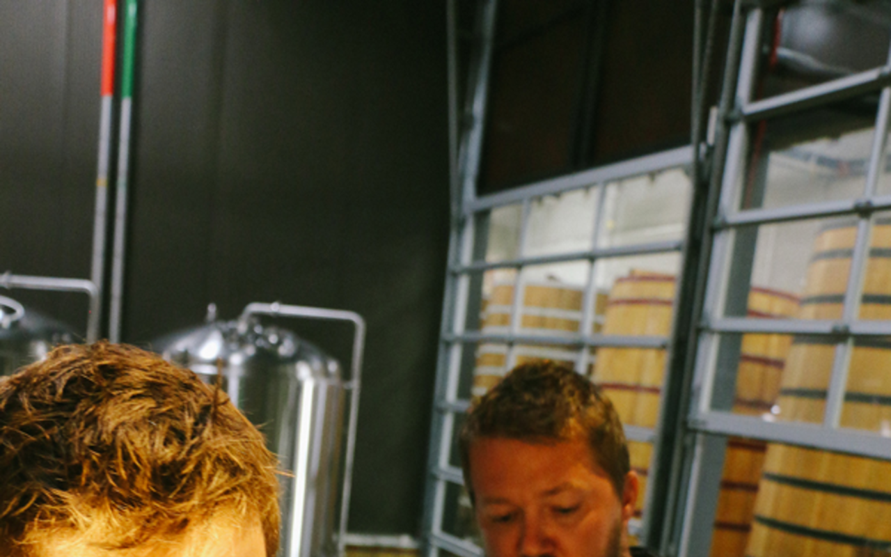 New Belgium brewer Ross Koenigs and Eric Trinosky, lead brewer at Cycle Brewing, monitor their brew.