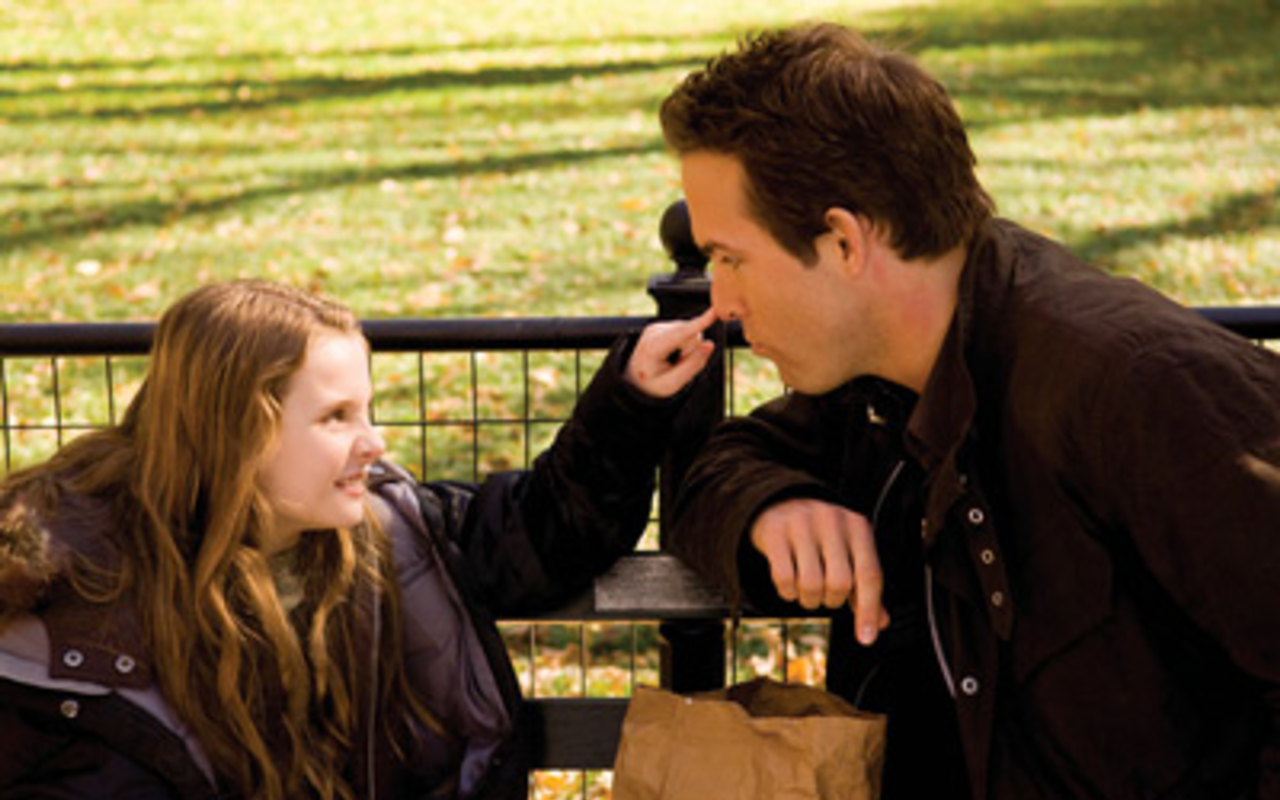 ON THE NOSE? Abigail Breslin tries to figure out how Daddy (Ryan Reynolds) met Mommy in Definitely Maybe.