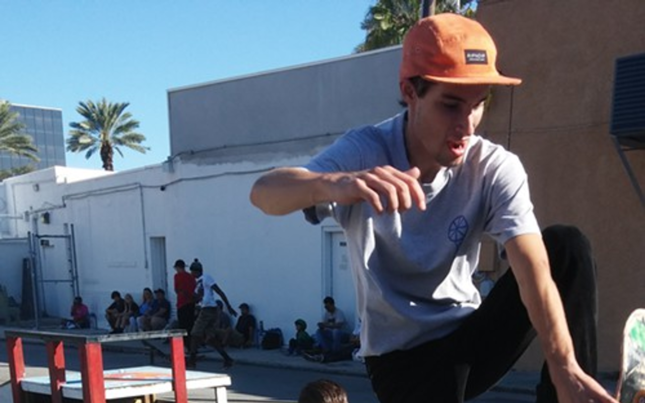 During skate contest on Saturday's celebration of Freshly Squeezed's two-year anniversary, filmmaker @softhoagierolls_ captures a skater performing a trick on the makeshift concrete quarter pipe.
