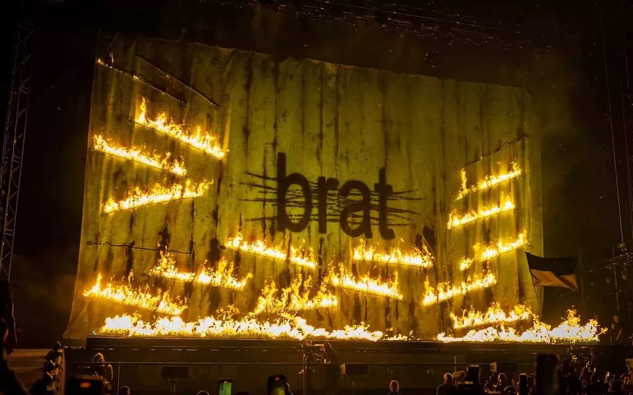 Charli XCX burned a flag of the neon green album cover during Glastonbury 2025.