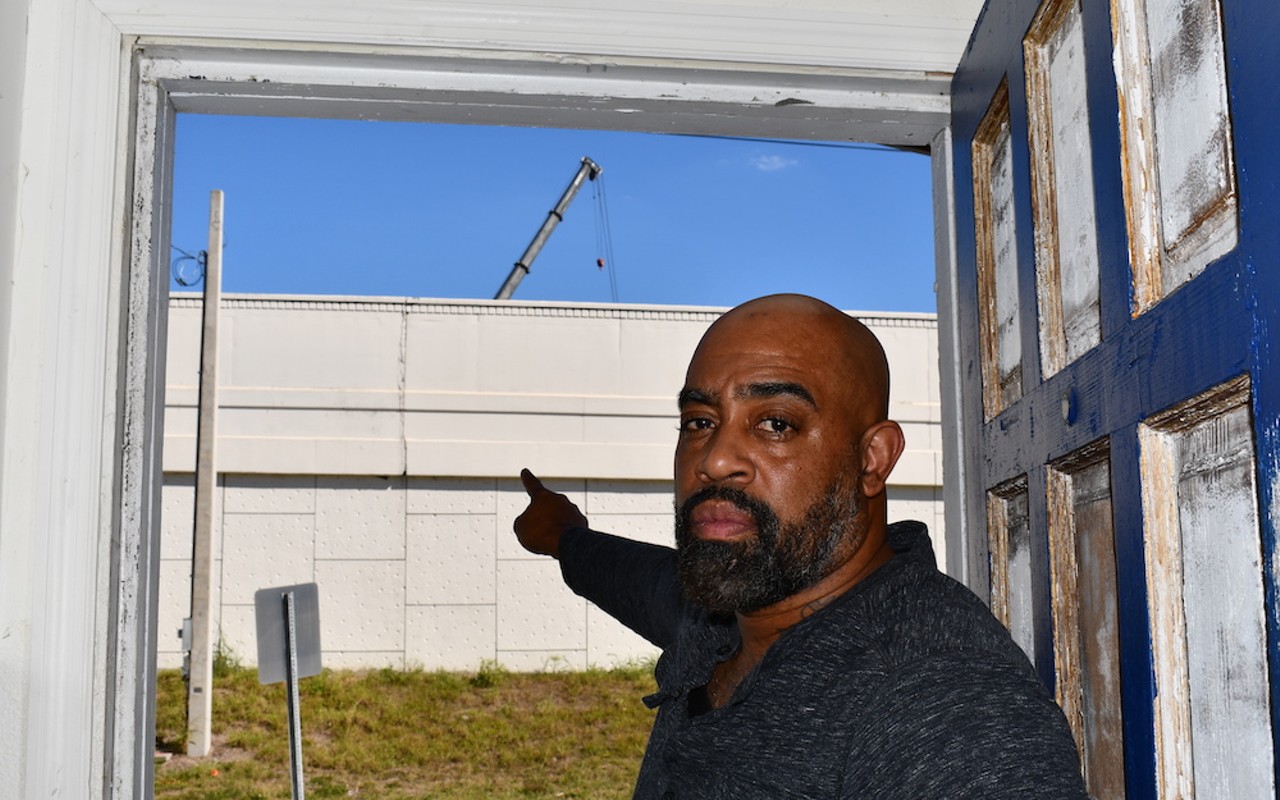 Ruben P. Bryant points at a pile driver being used by FDOT for interstate construction right next to his house.