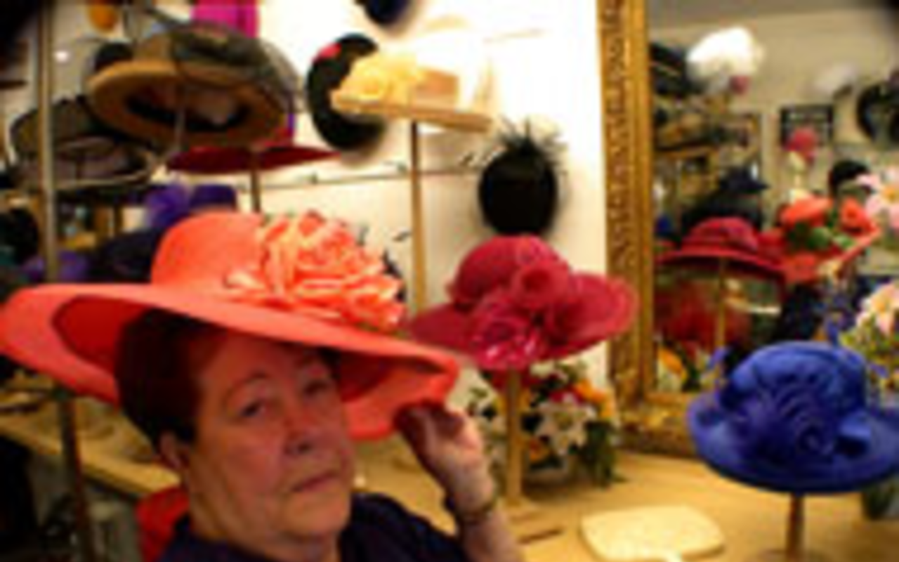 TOP HATS: Betty Masar, owner of Woodies Hat Box, 
    sells premium Jack McConnell hats that cost up to 
    $700.