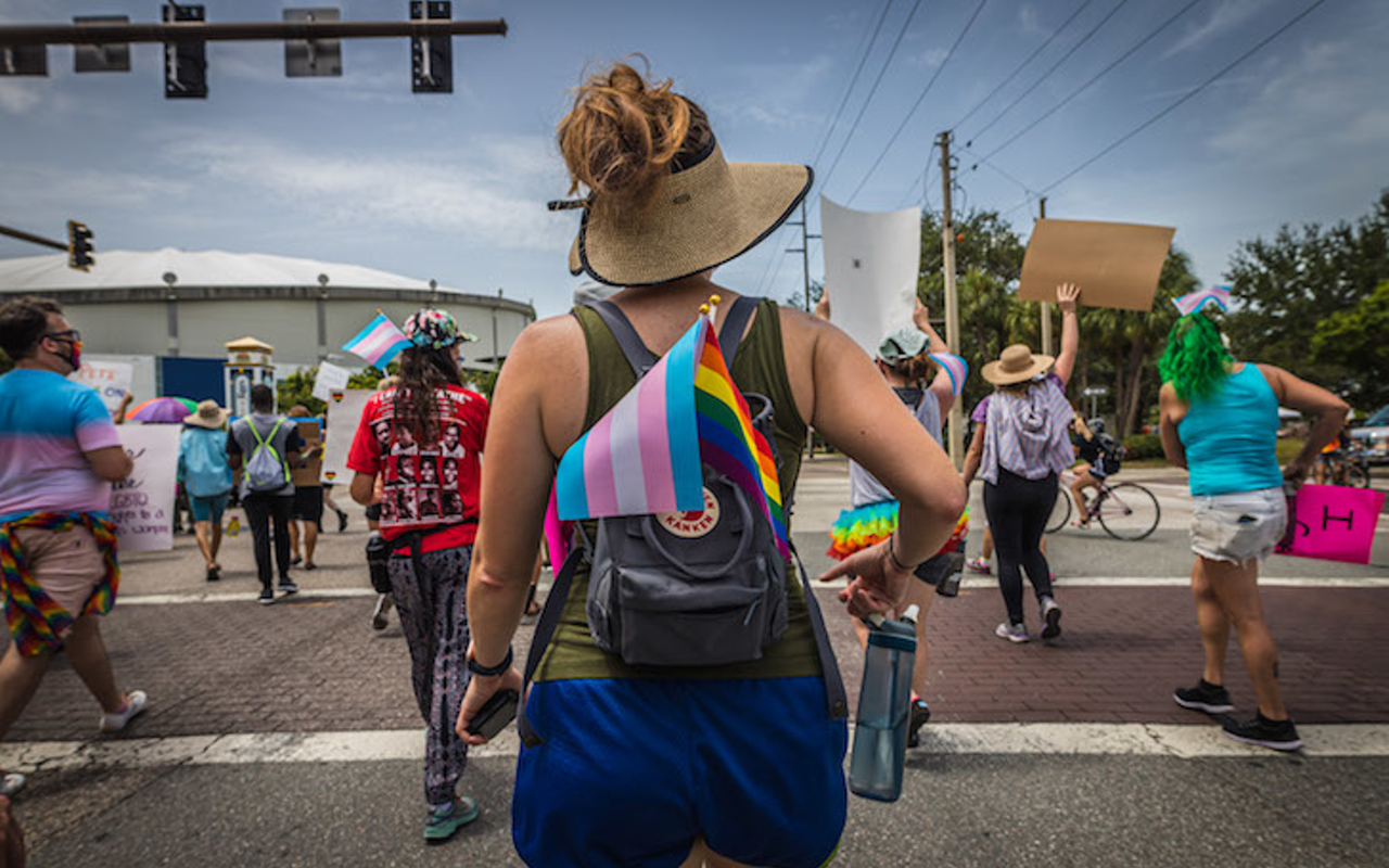 A protester marches with the trans and pride flag in St. Petersburg, Florida on June 28, 2020.