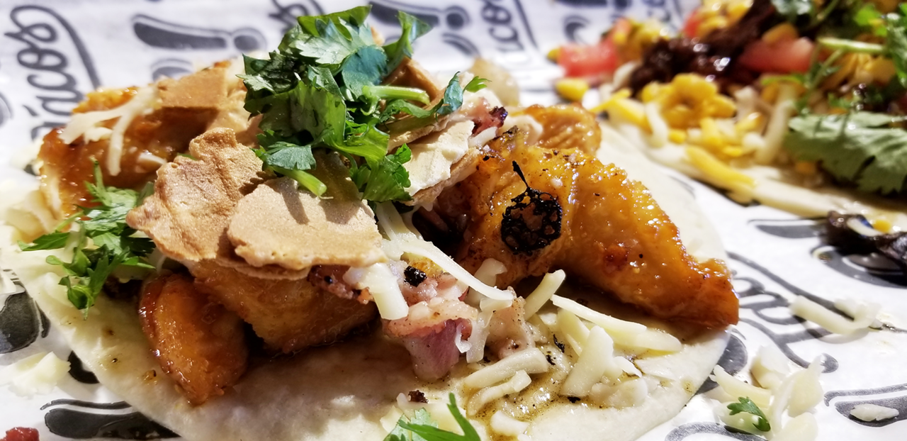 The Spicy Banty — an exclusive taco at Capital Tacos St. Pete — features fried chicken glazed with spicy agave and covered in waffle bits, bacon, cilantro and cheese.