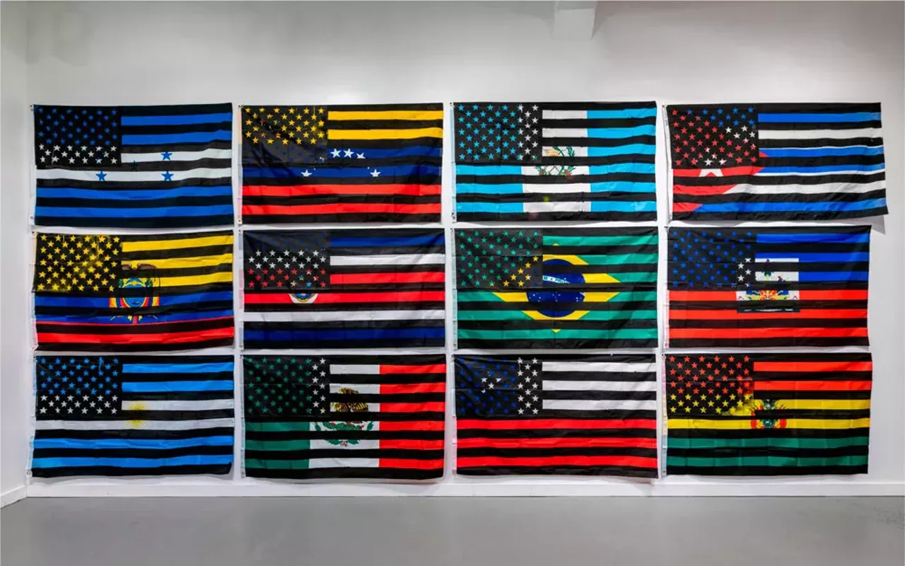 Eddy A. L&oacute;pez (b. 1978, Matagalpa, Nicaragua), In-Dependencia, 2021-2022. Silkscreen, acrylic on fabric. dimensions variable: each of 16 flags is 3 x 5 feet