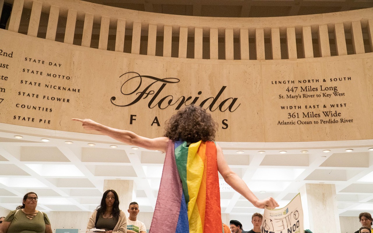 Will Larkins, an 18-year-old Winter Park High School senior, points to the House Chamber, criticizing bills that target transgender rights during the transgender visibility day rally at Florida’s Capitol in Tallahassee, Fla, on Mar. 31, 2023.