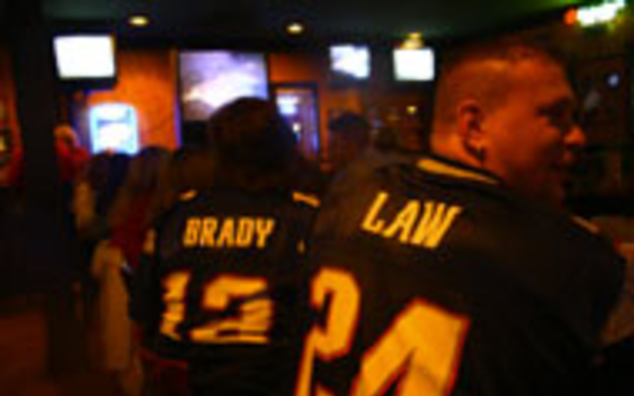 TEAM SPIRIT: Michelle (Brady) and Richard (Law) 
    watch the game at Wing House.