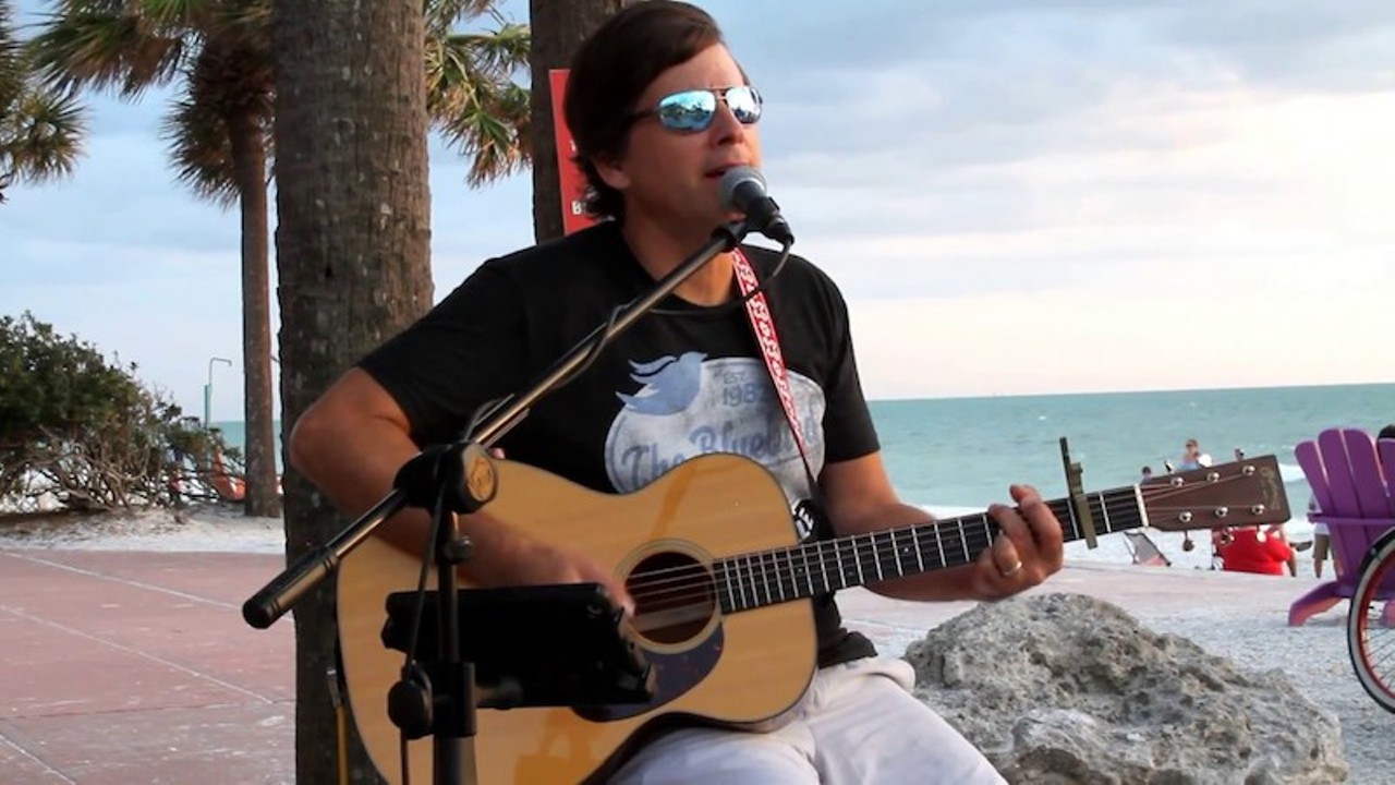 John Frinzi &#151; &#147;Buoyancy&#148;
Bay area Jimmy Buffett pal John Frinzi sings about pina coladas with no fruit no umbrellas in tumblers on this 2009 song he wrote on a boat headed to Cancun. 
Photo via YouTube (Screenshot by CL Tampa)