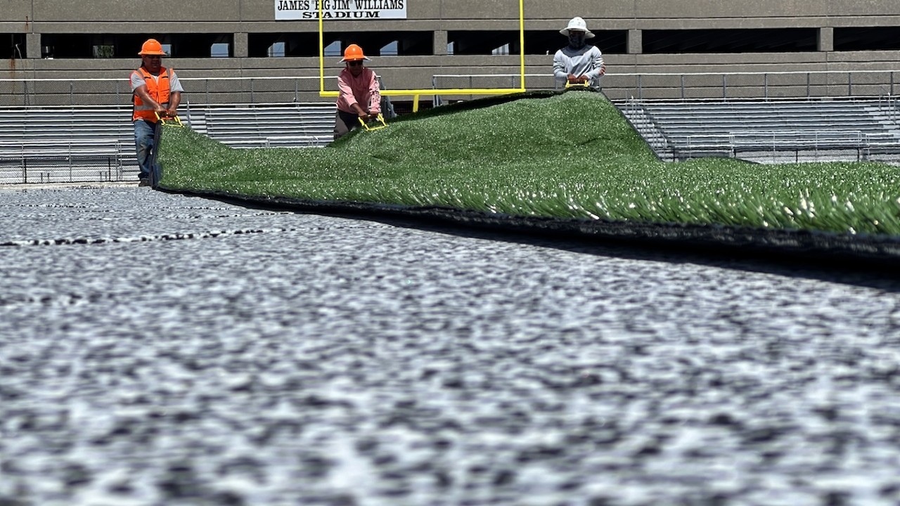 Turf rollout at Blake High School in Tampa, Florida on July 1, 2024.