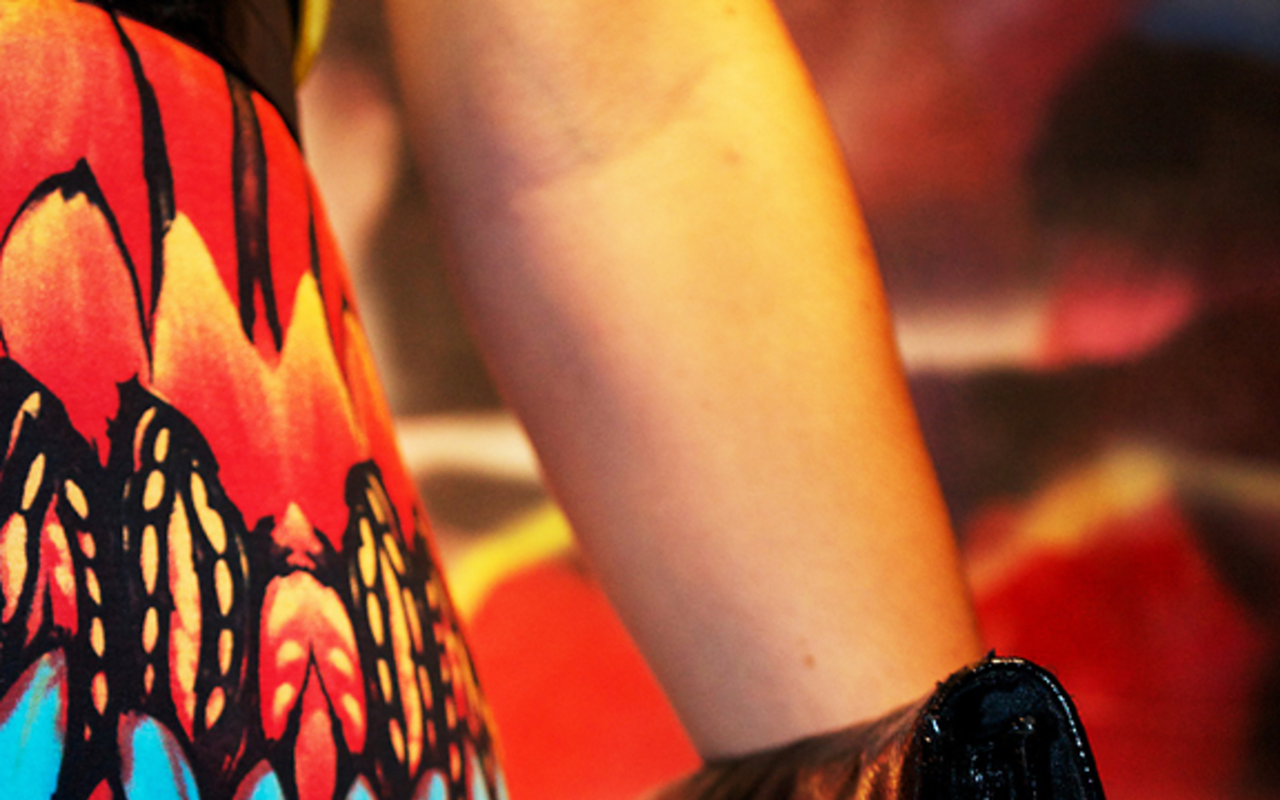 Detail of Natalia Galbetti’s patterned dress and clutch.
