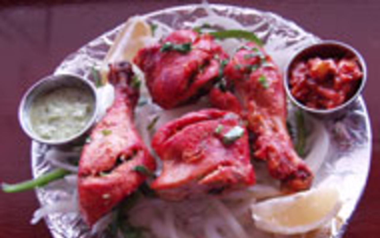 CODE RED: The bright red tandoori drumsticks are 
    an Indian restaurant classic.