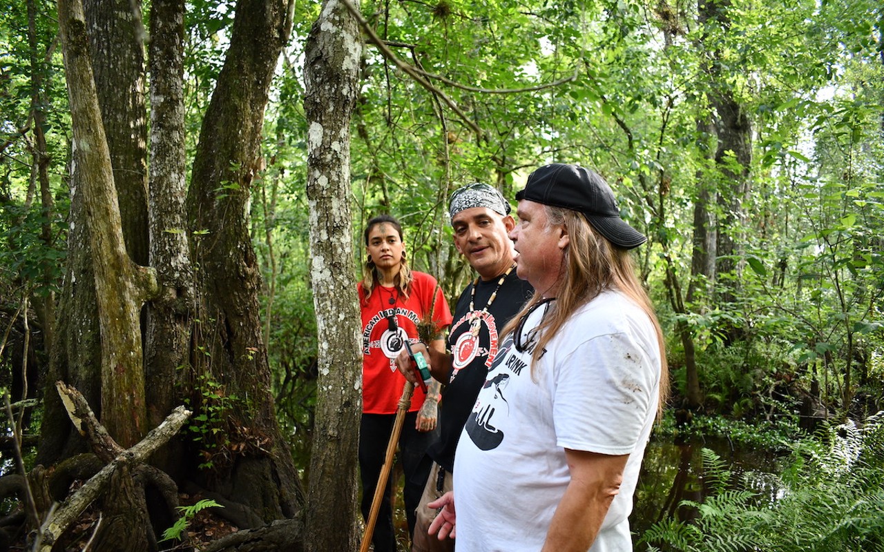 Members of FIA during a hike through USF Forest Preserve to investigate a sacred burial site that's being looted.