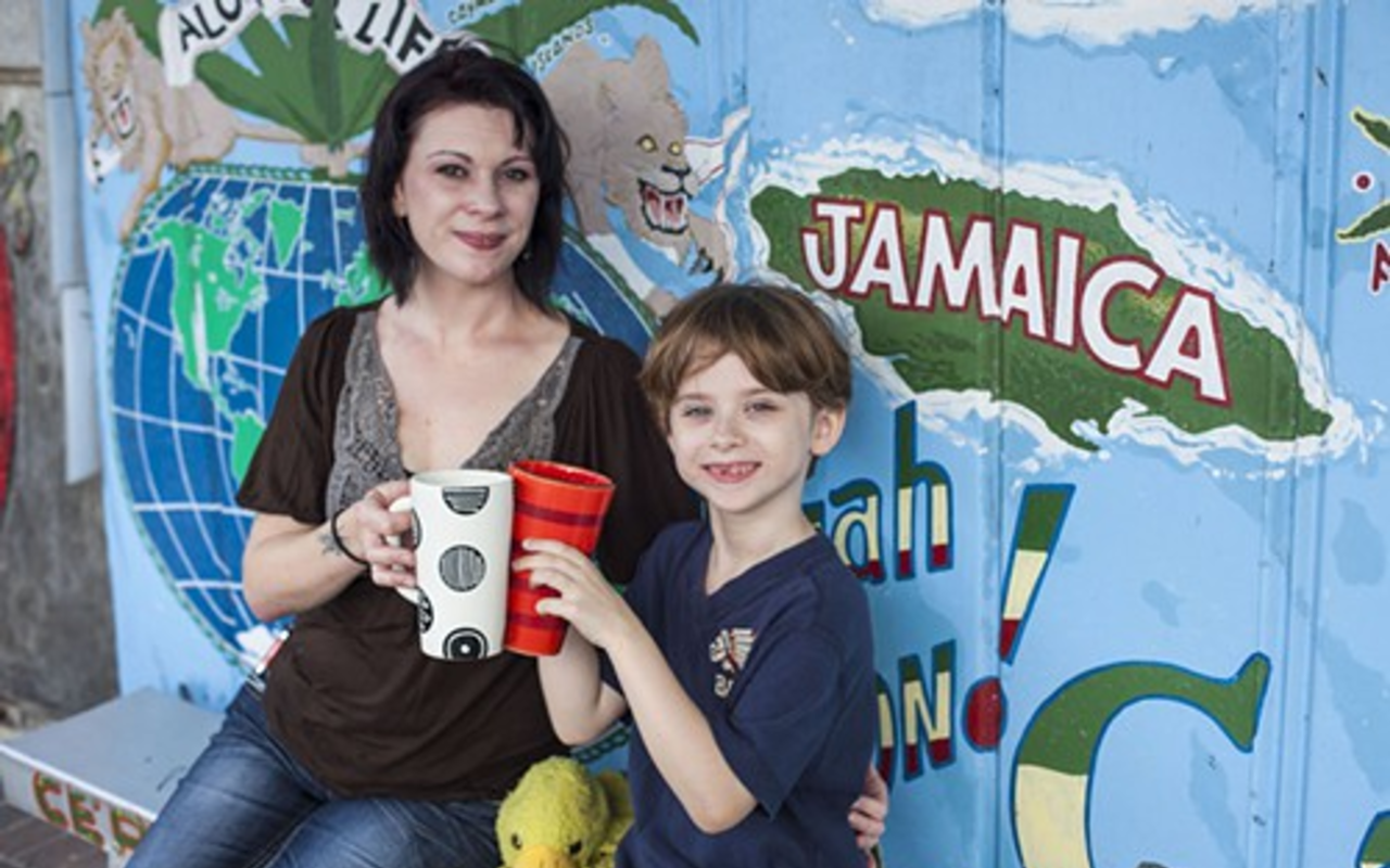 Alexis Springer and son, Julian, sip ginger root tea at Cephas' Jamaican Hot Shop.