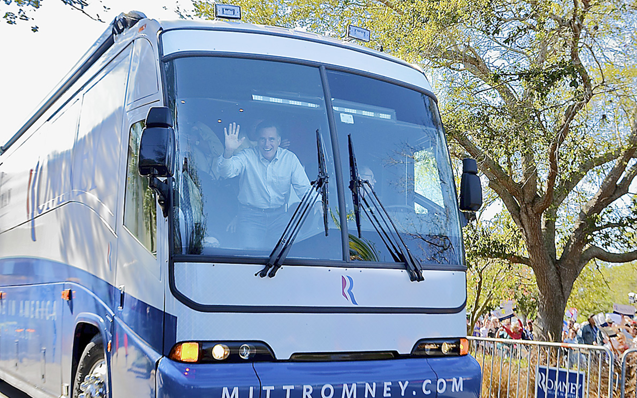 MOVE THAT BUS! The Mitt brigade rolled into Dunedin for a big rally the day before the primary.