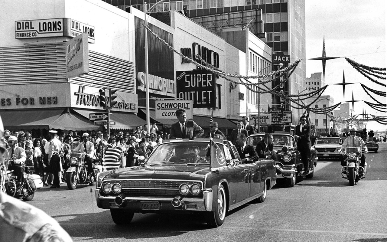 TWIGGS AND FRANKLIN: President John F. Kennedy’s motorcade proceeds through a bustling 1962 downtown that’s now almost unrecognizable.