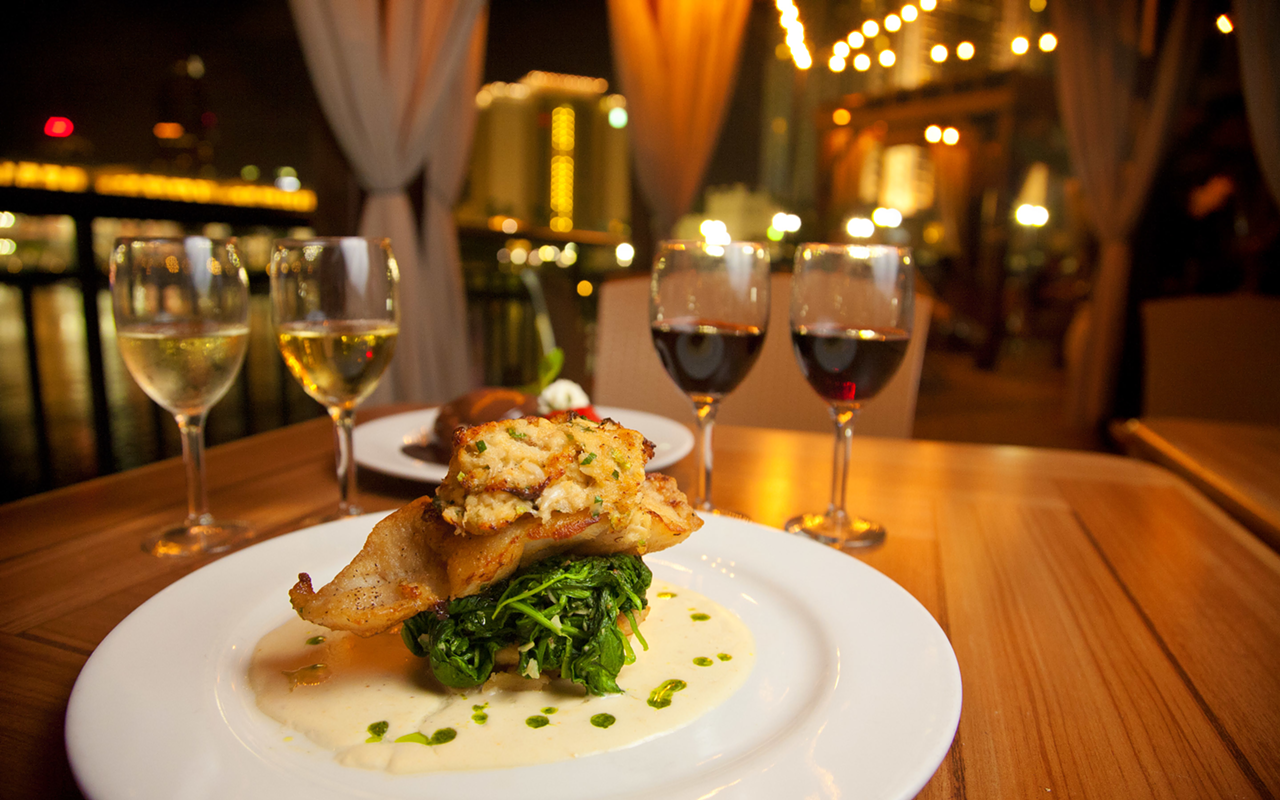 TAKE FLIGHT: A wine flight and the grouper stack with crabmeat at Jackson’s.