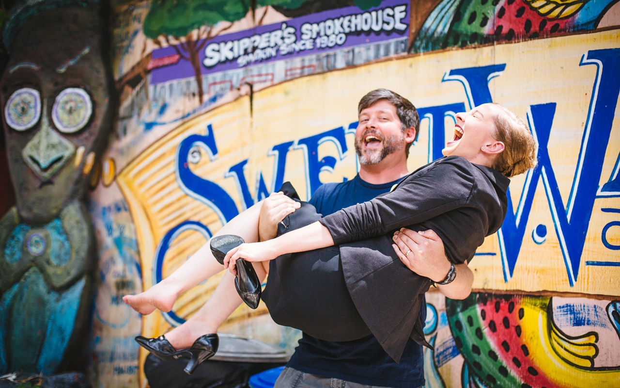 UPLIFTING DIRECTOR: Chris Holcom hoists Occupation star Emily Belvo during a promo shoot at Skipper’s Smokehouse.