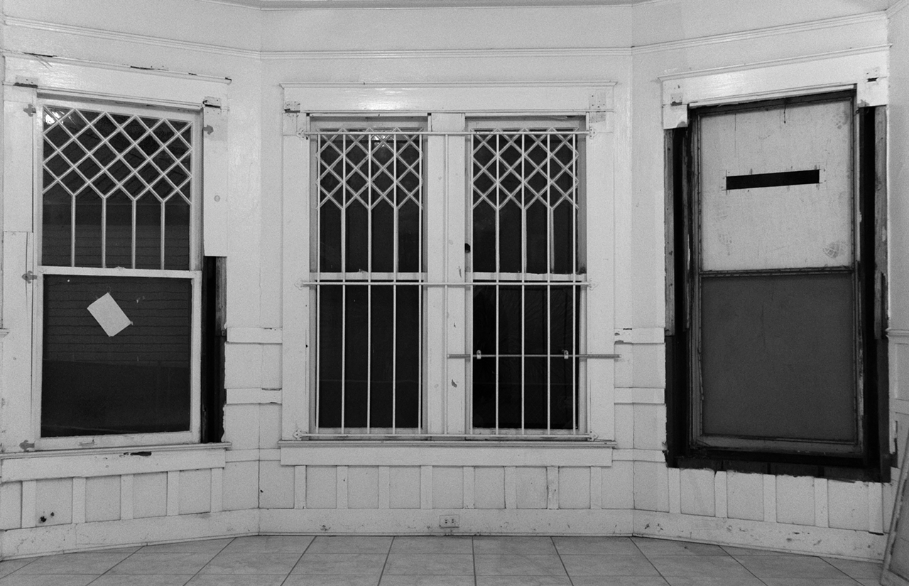 Black and white photography is great for emphasizing lines and structure, by the way. I was drawn to that diamond pattern at the top of each window.