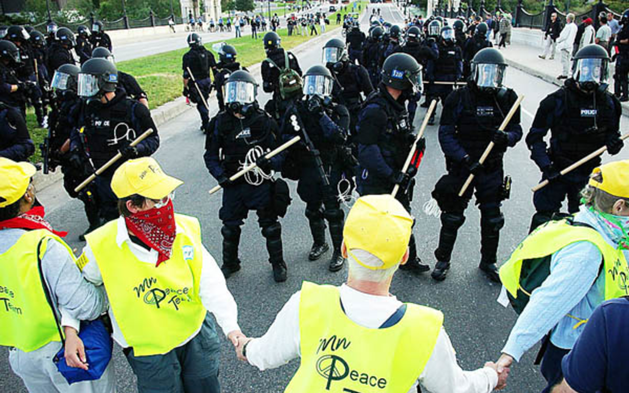 Members of the Peace Team come face to face with riot police during the 2008 RNC in St. Paul, Minnesota.