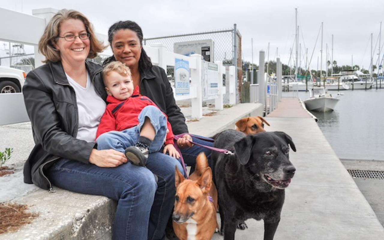 Nadine Smith (right) with spouse Andrea Hildebran, son Logan, and canine companions photographed last year in Gulfport.