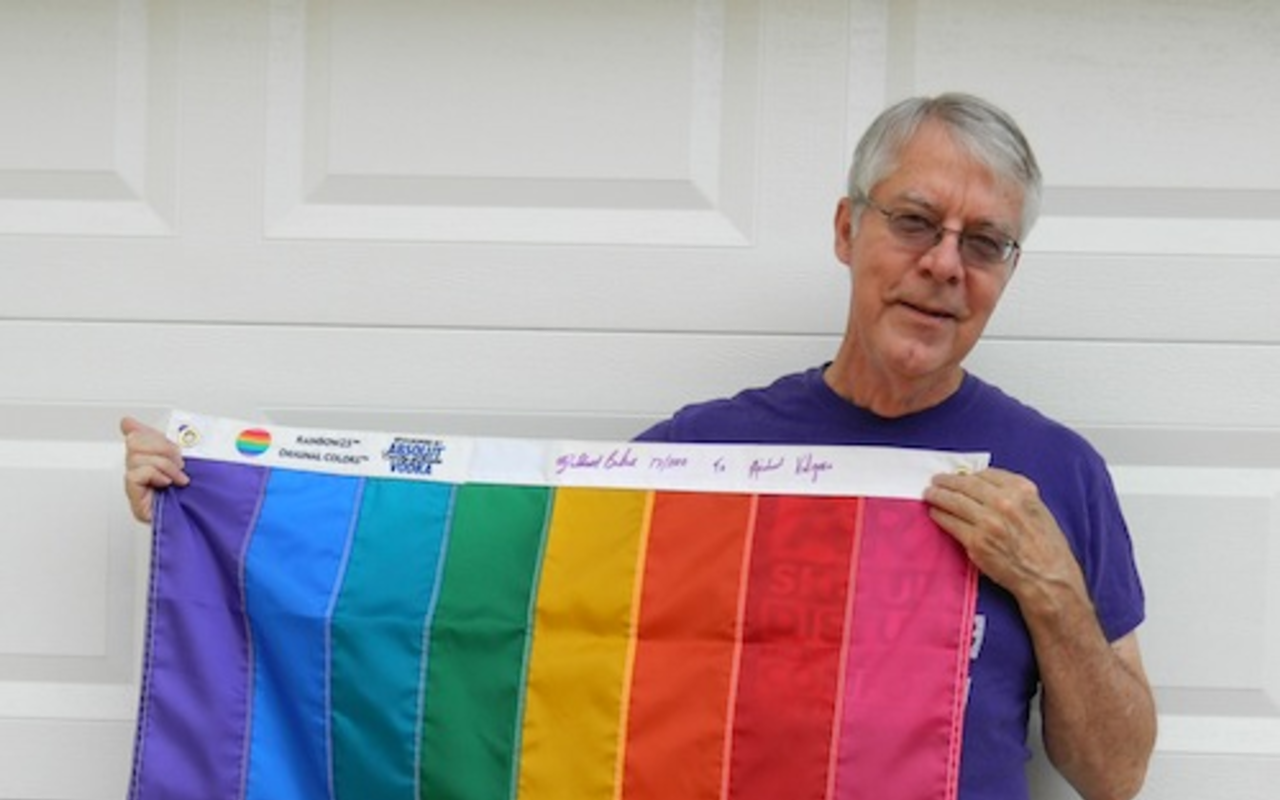 Michael Kilgore with is eight-stripe rainbow flag.