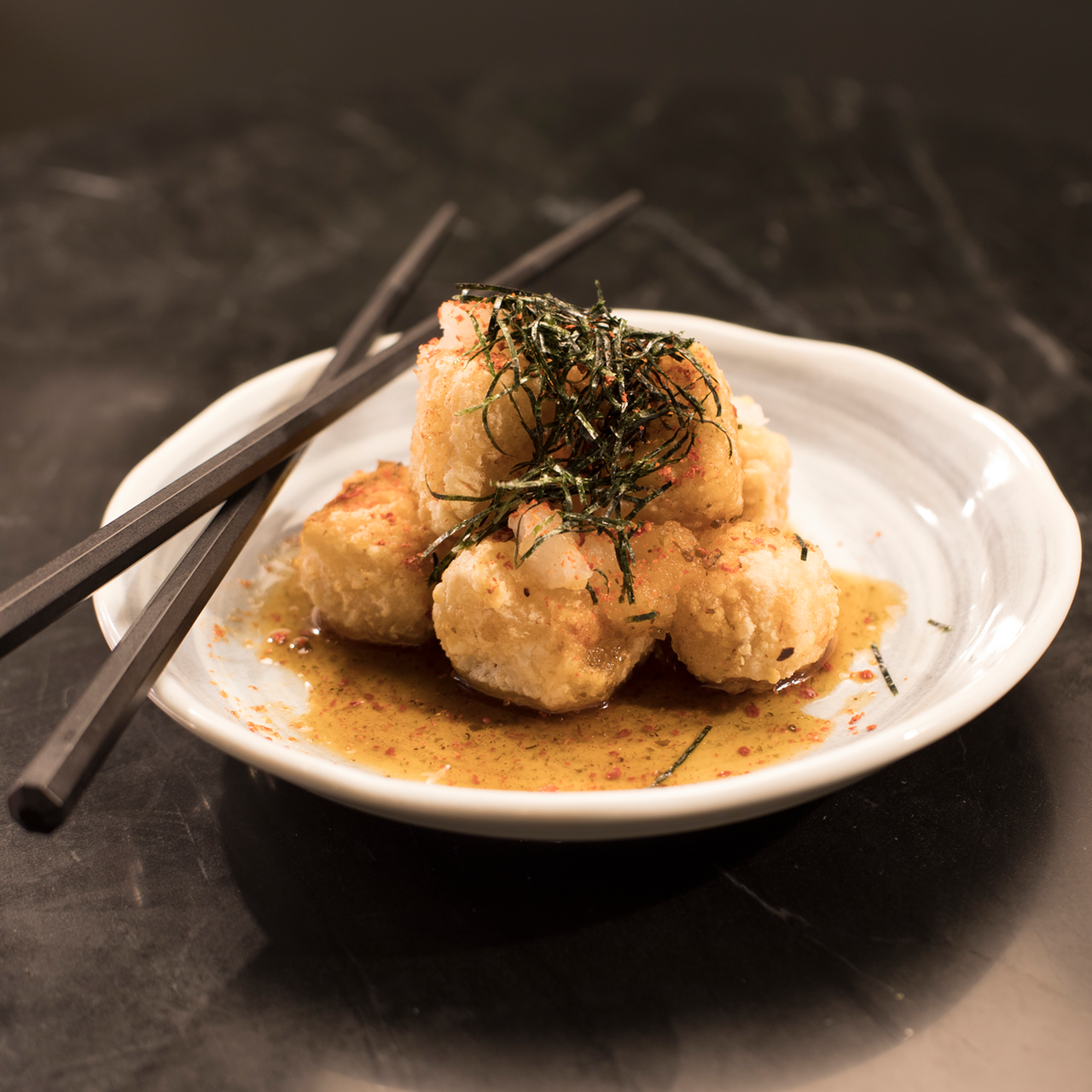 The tempura-fried tofu karaage offers memorable flavors and texture.
